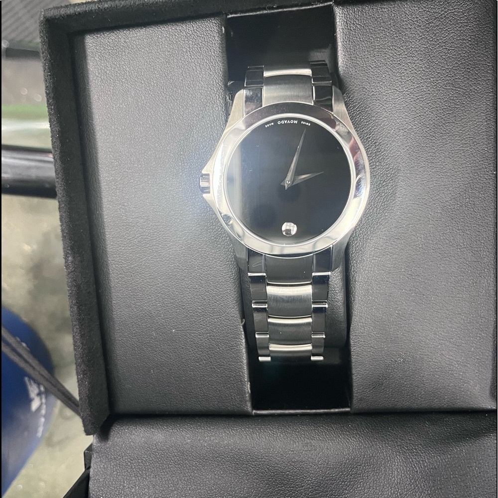 Movado watch. Never worn. Still in original box. Flawless